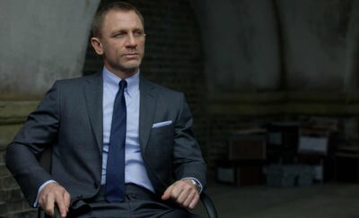 Solemn person in grey suit.