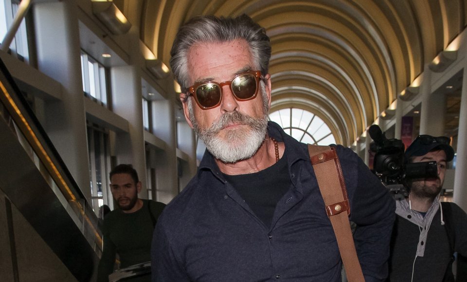 Pierce Brosnan Has Mastered The DILF At The Airport Look… Please Take Note