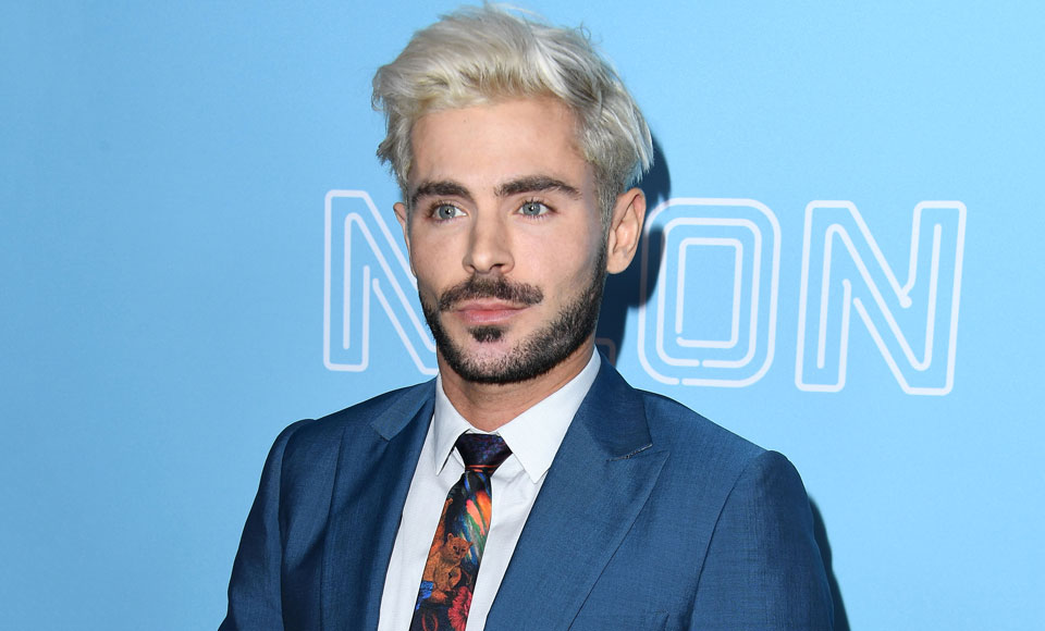 Zac Efron Has Perfected The Sleazy 80s Popstar Look & You Should Be Afraid