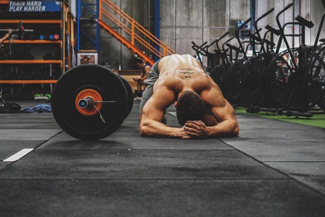 tired shirtless man in the gym tired shirtless man in the gym