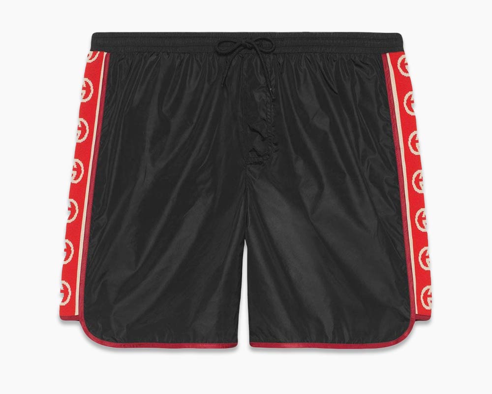 Gucci swim shorts in black with Gucci logo on sides