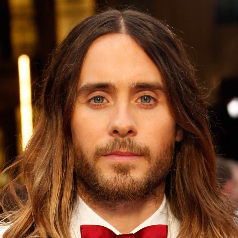 Jared Leto with long hair curtains hairstyle and blonde tips.