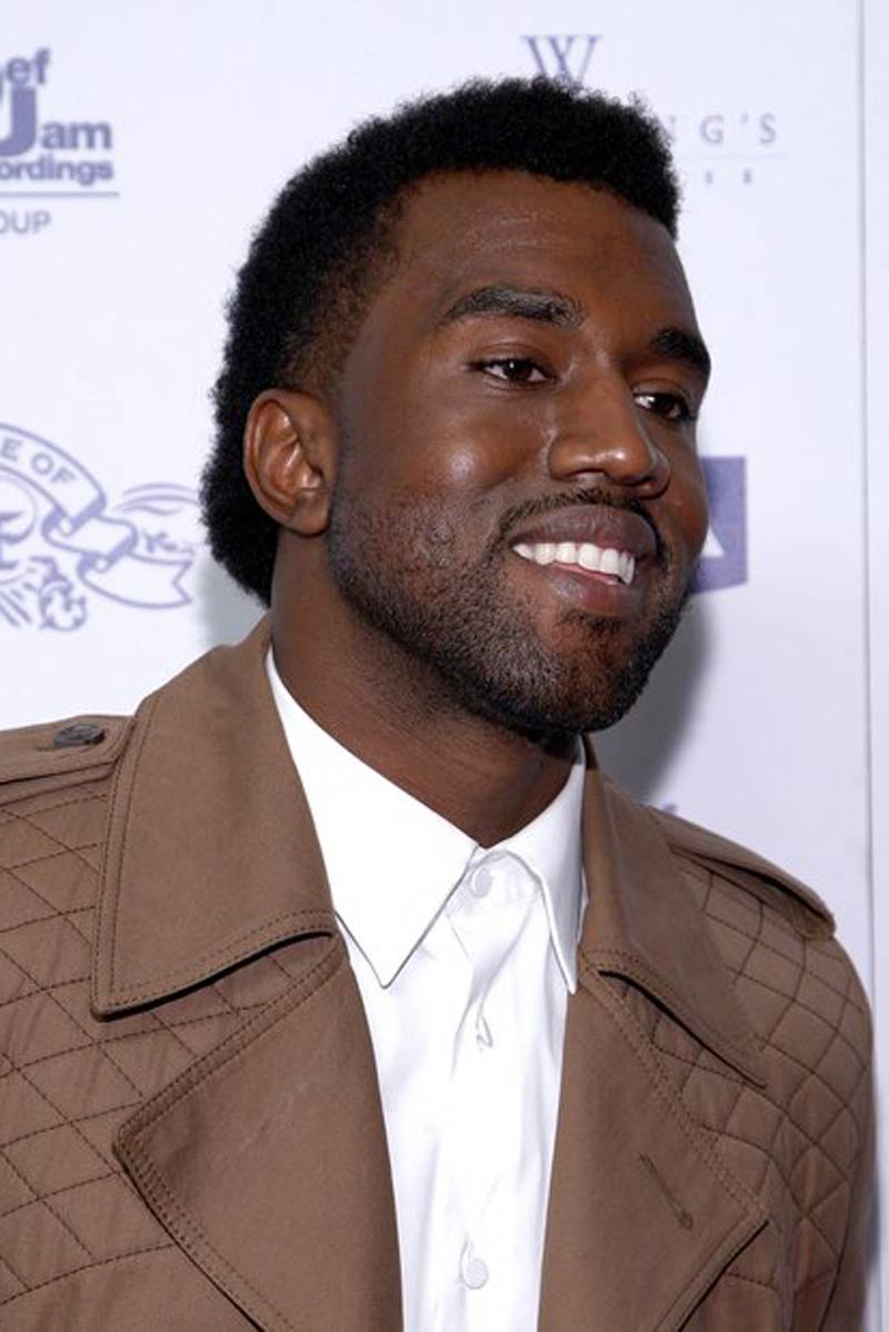 Kanye West with afro mullet hairstyle