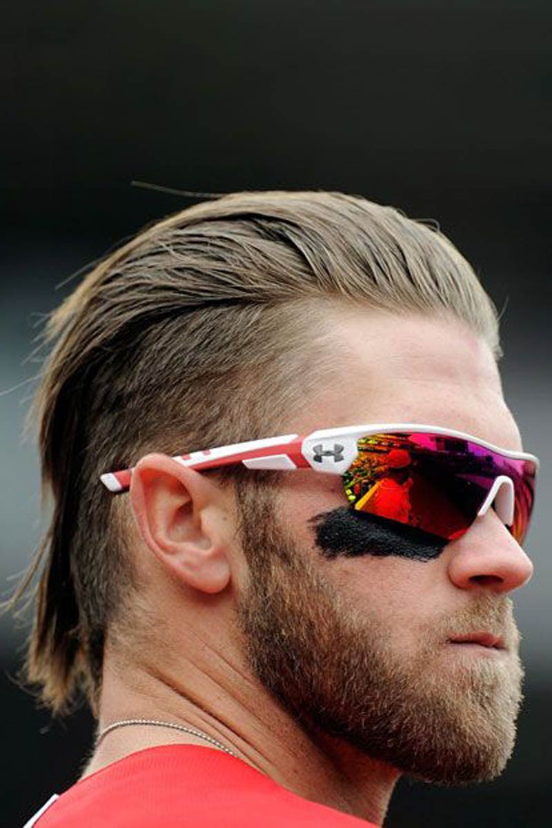 Man with undercut mullet wearing cycling glasses