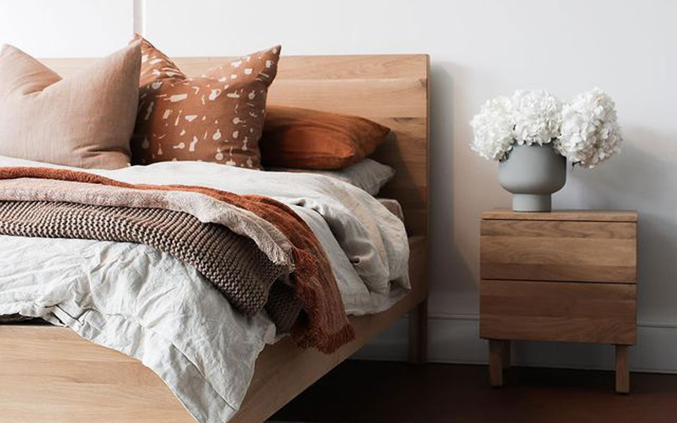 RJ Living wooden bed with matching side table, white and burnt orange bed linen