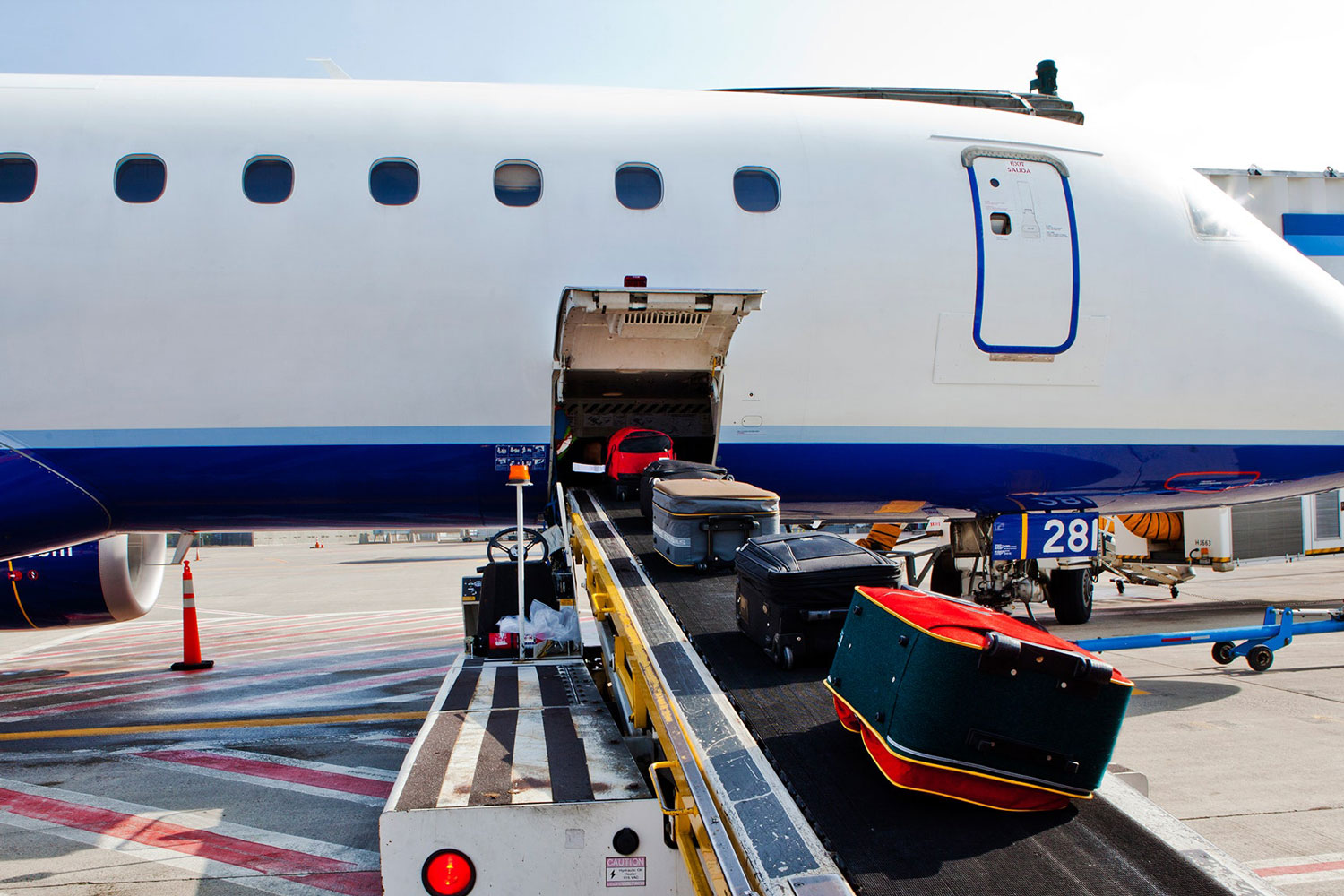 Baggage Handler Reveals What Really Happens To Your Luggage In The Belly Of A Plane