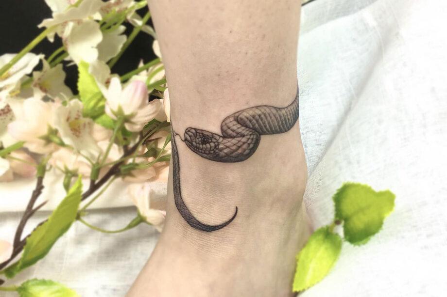 Snake wrapped around the dagger tattoo  Tattoogridnet