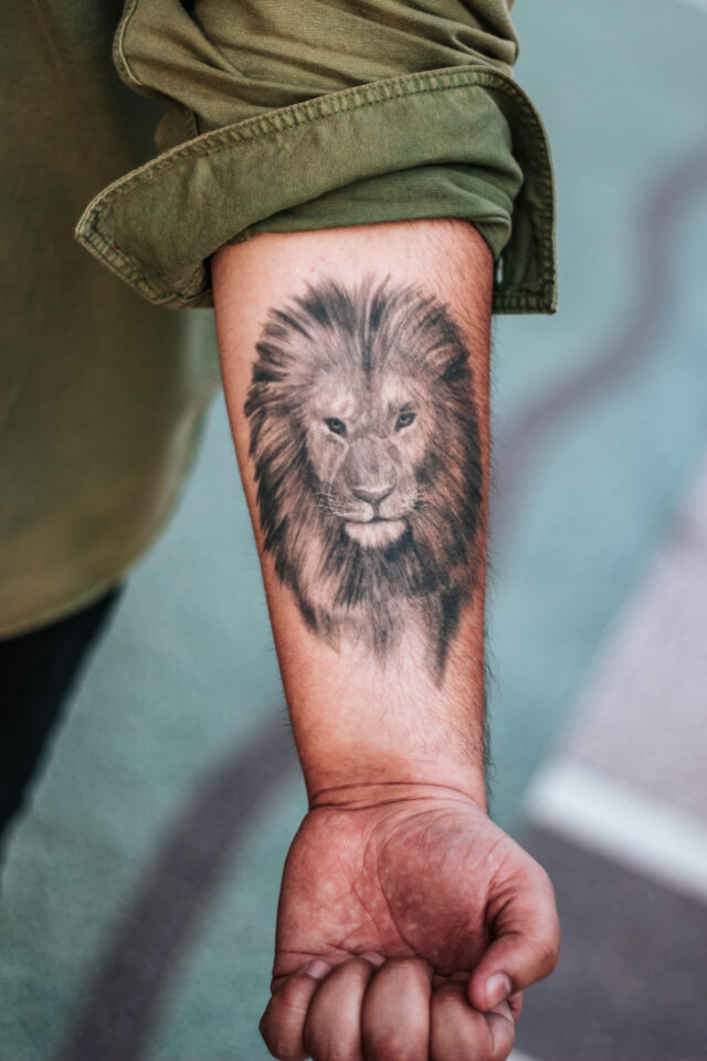 Lion forearm tattoo
