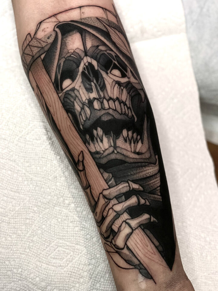 Skull forearm tattoo