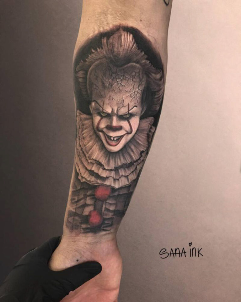 Clown forearm tattoo