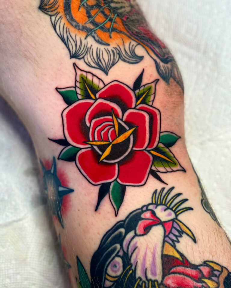 Rose kneee tattoo