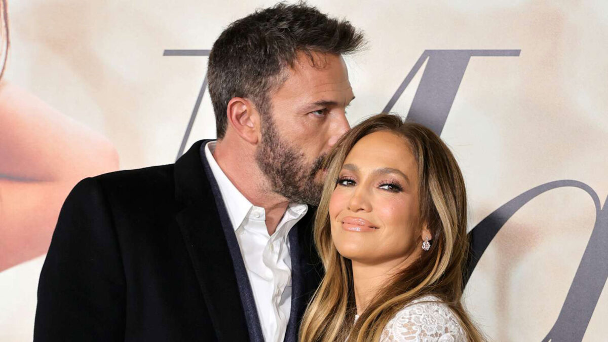 Ben Affleck giving his wife, Jennifer Lopez, a kiss on the head