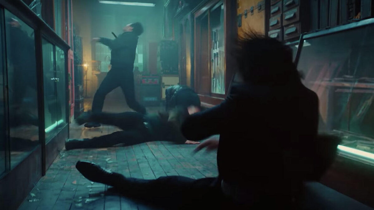 A fight scene in a hallway.