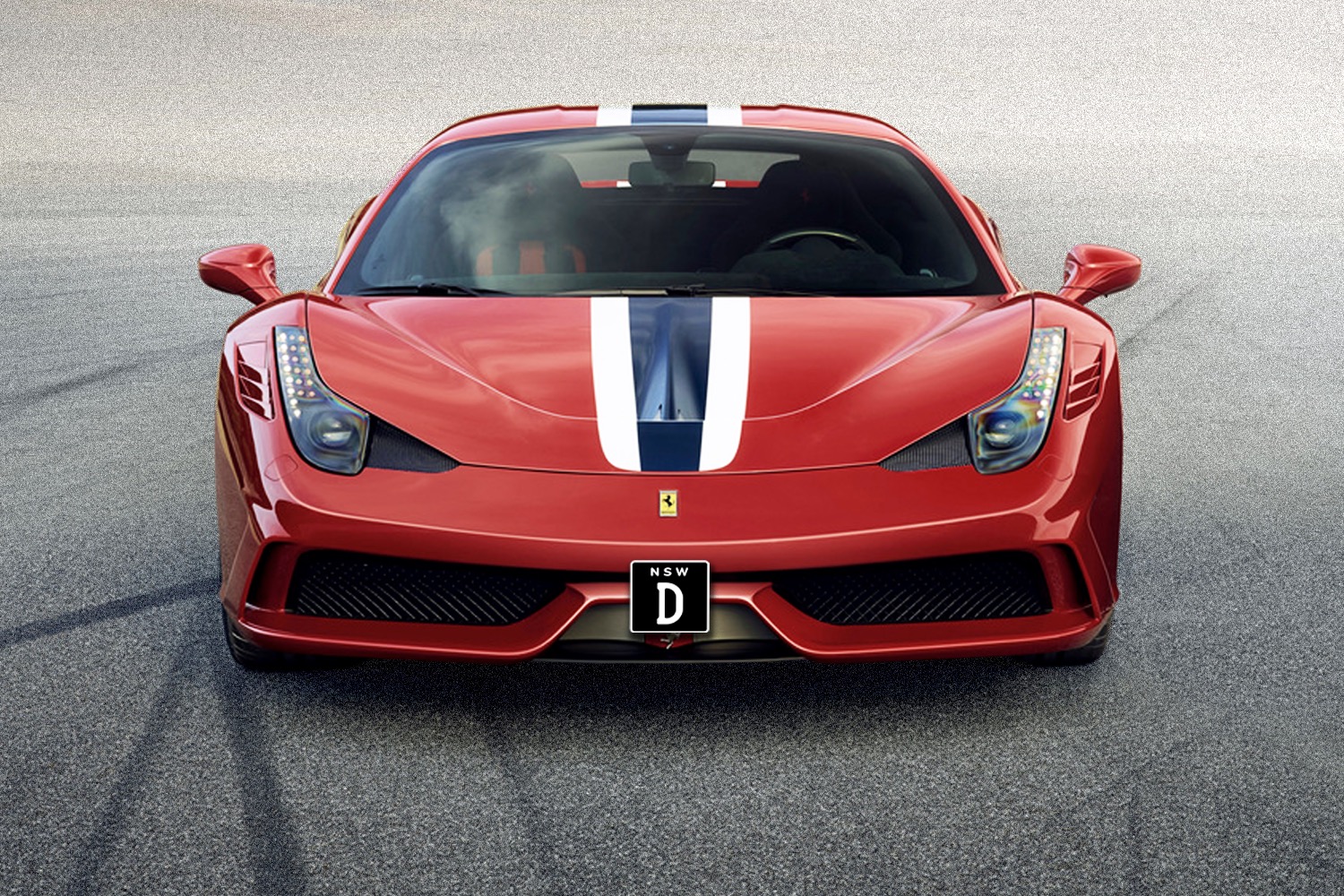 A Ferrari with a 'D' license plate.