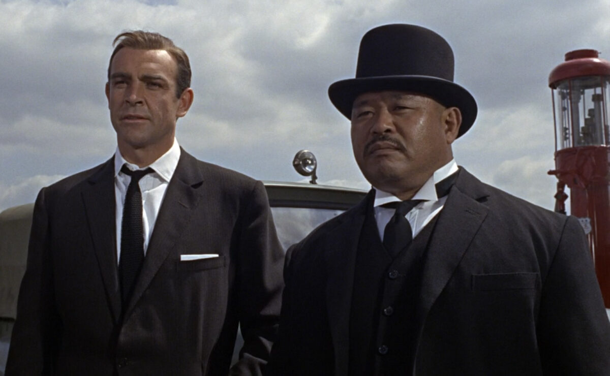 Korean henchman Oddjob, portrayed by Harold Sakata, alongside Sean Connery in Goldfinger (1964)