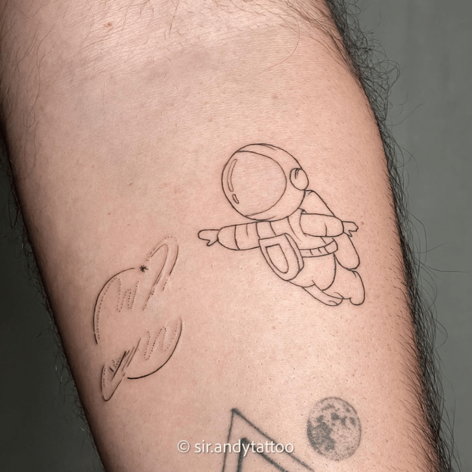 Astronaut Single Line Tattoo Source @sir.andytattoo via Instagram