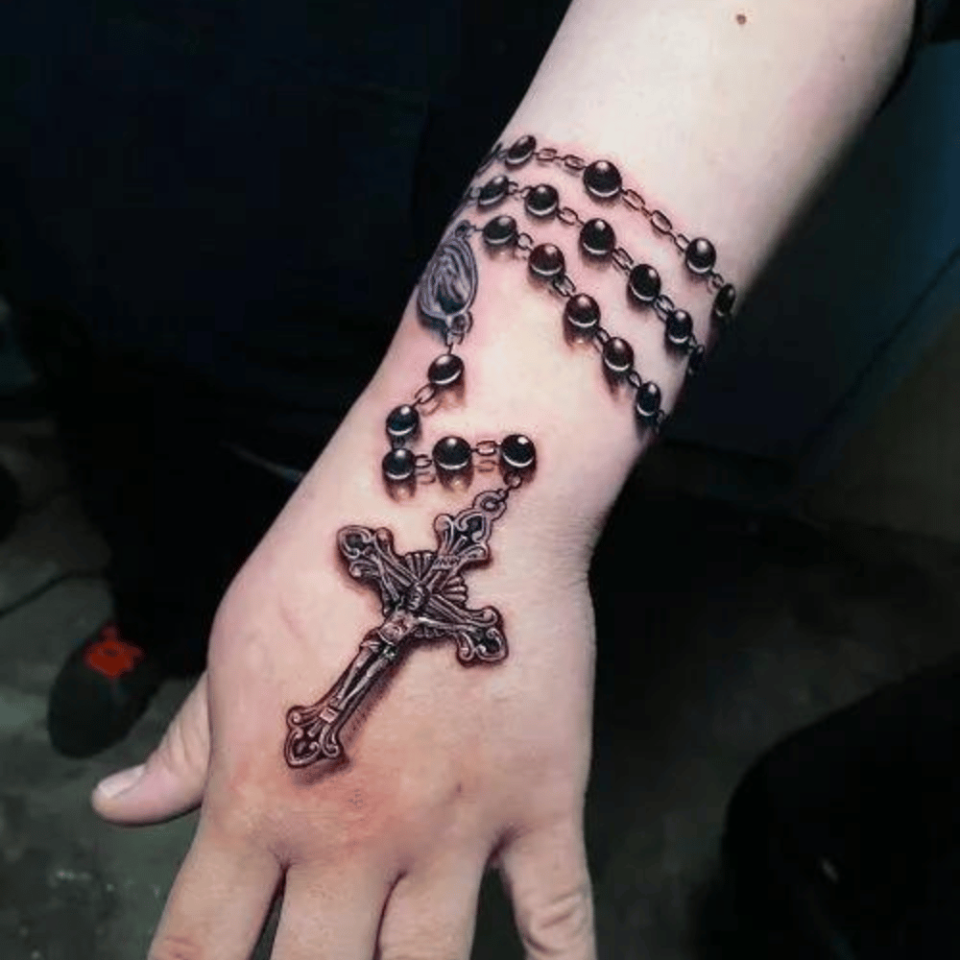 Catholic Cross Tattoo Source @oceanfronttattoo via Instagram