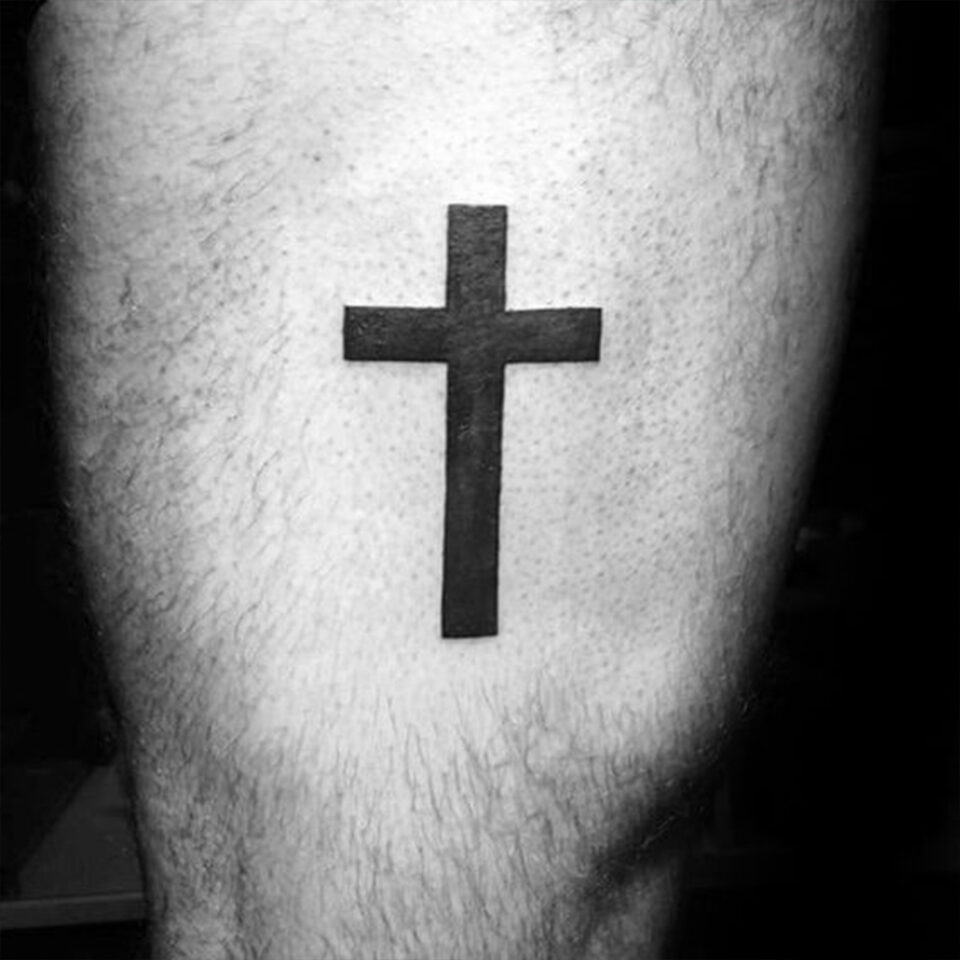 Cross Thigh Tattoo
