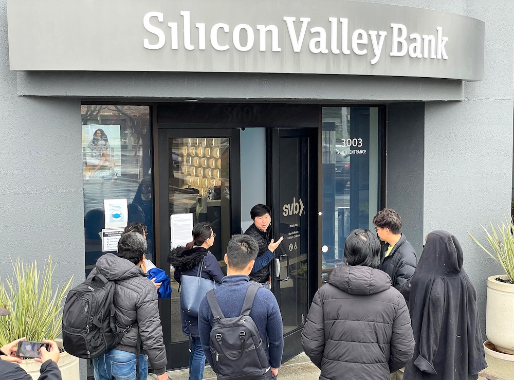People crowding around the entrance to a Silicon Valley Bank branch.