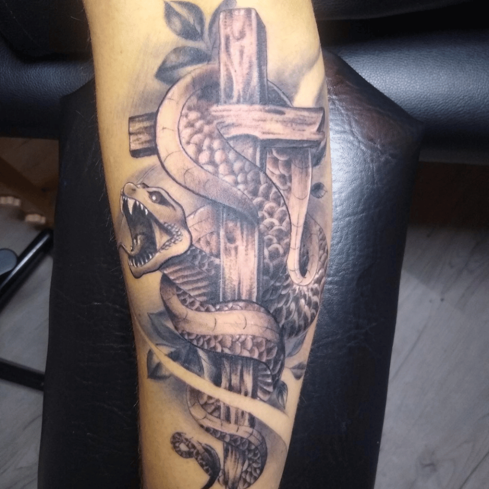 Snake Cross Tattoo Source @ProphecyInk via Instagram