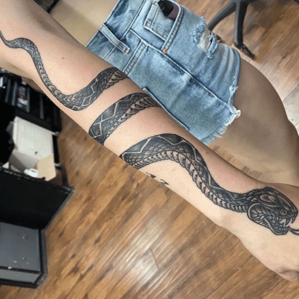 Tattoo uploaded by Valentino Dellagiacoma  Snake wrapping around the arm   Tattoodo