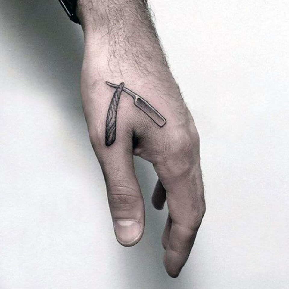straight blade hand tattoo