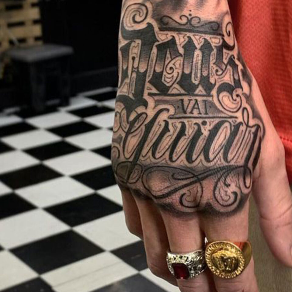 lettering hand tattoo