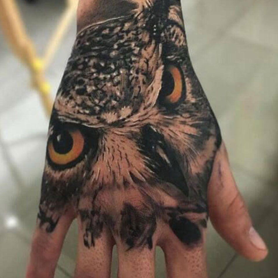 owl hand tattoo