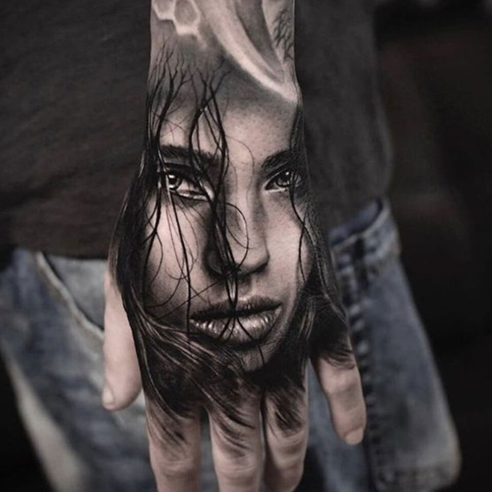 portrait hand tattoo