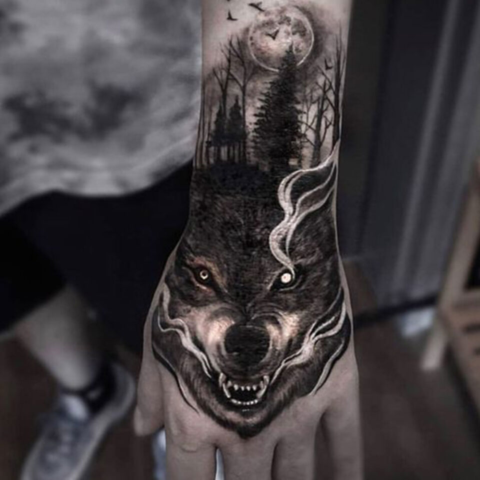 wolf hand tattoo