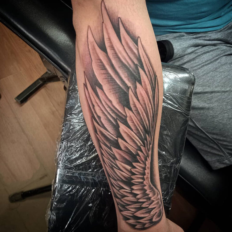 Angel Wing Arm Tattoo