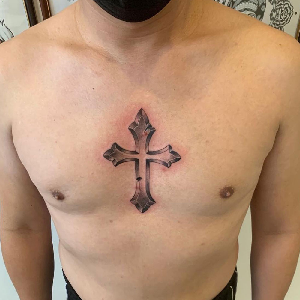 Chest Cross Tattoo Source @monn_tattoo via Instagram