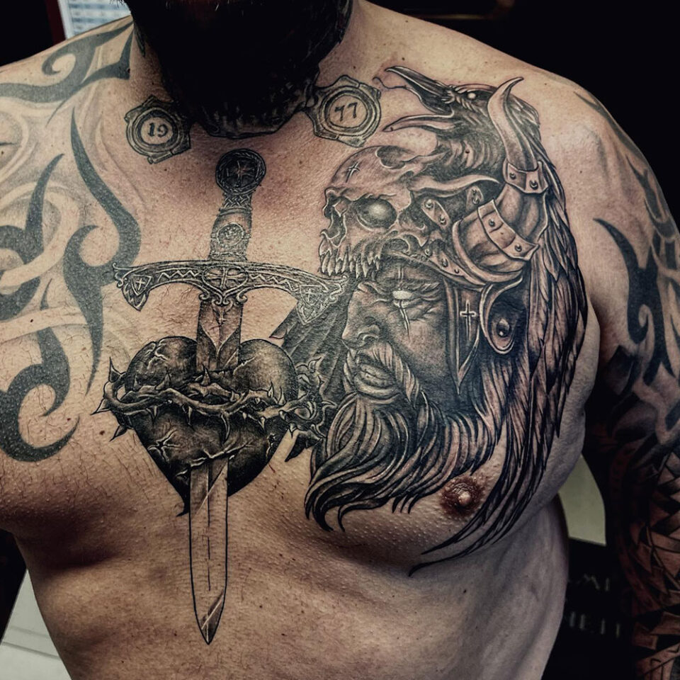 Dagger Chest Tattoo Source: @tatrock_tattoo via Instagram