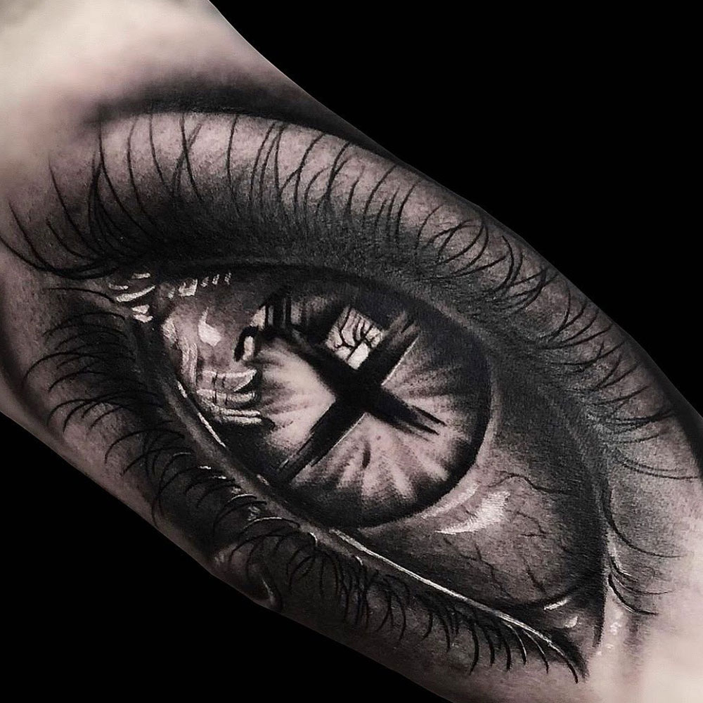 Eye Cross Tattoo Source @v.timina.tattoo via Instagram