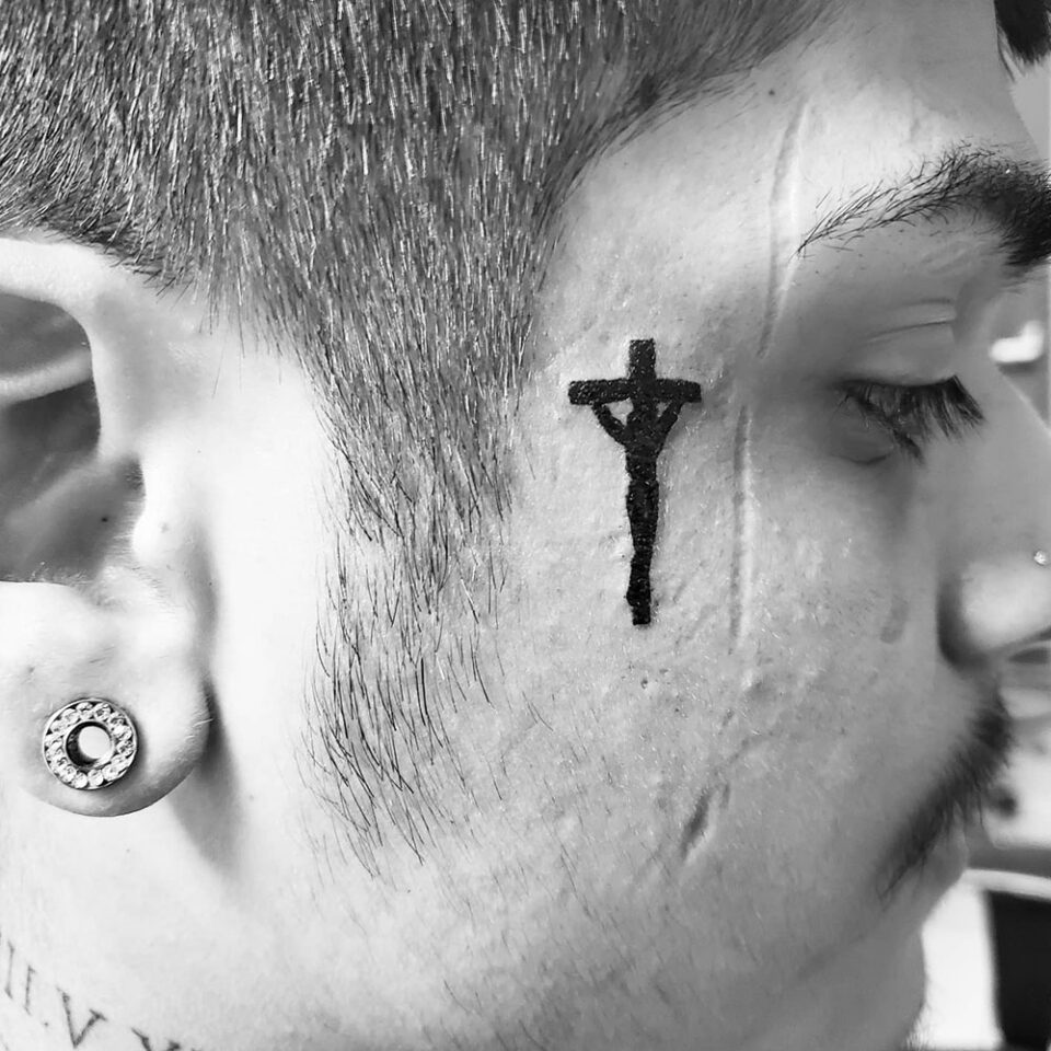 Face Cross Tattoo Source @bred_artwork via Instagram