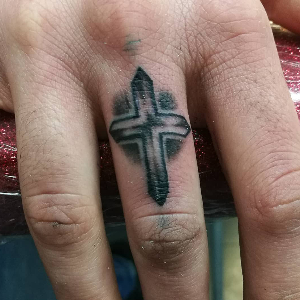 Finger Cross Tattoo Source @loulootattoo via Instagram