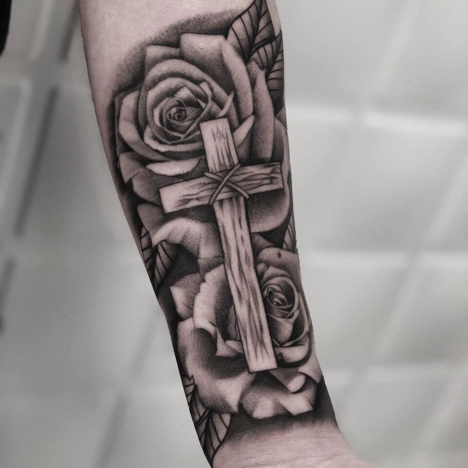 Forearm Cross Tattoo Source @triolo_tattoos via Instagram