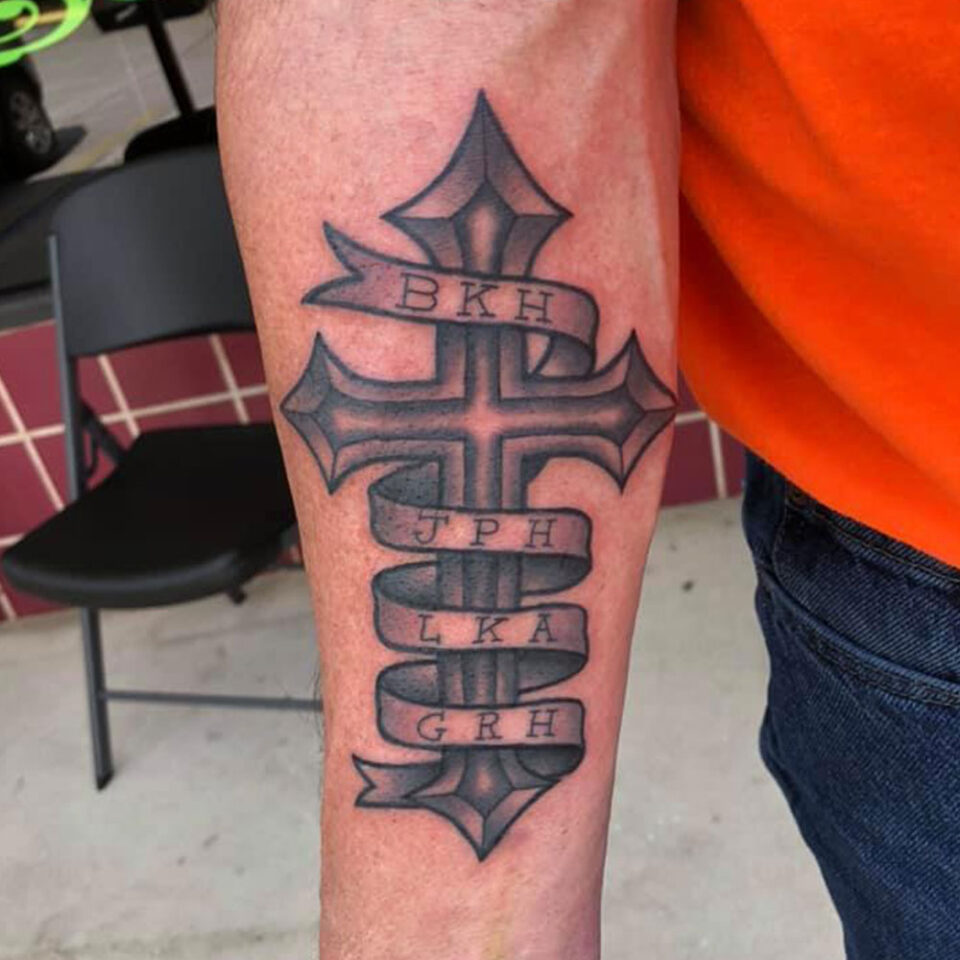 Forearm Cross Tattoo Source @tattoosbyjasonhigdon via Instagram