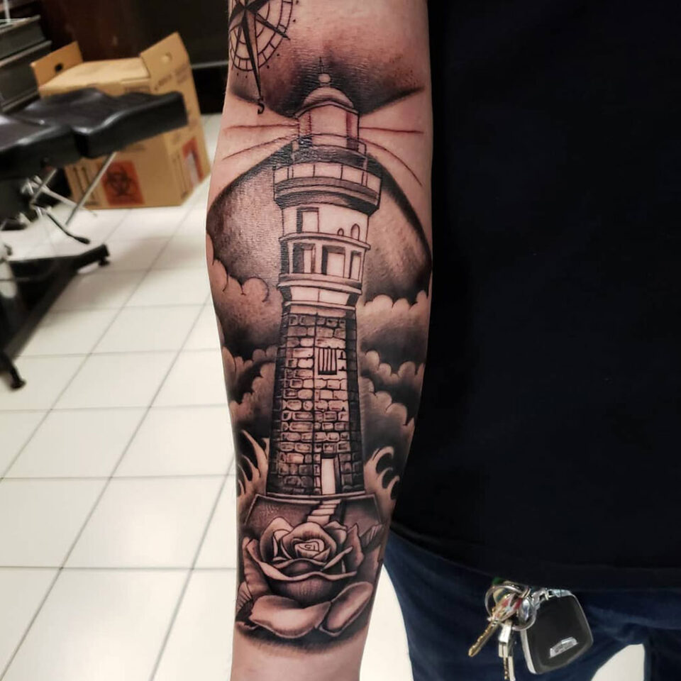 Lighthouse Tattoo Source @goal_digger_piercing via Instagram