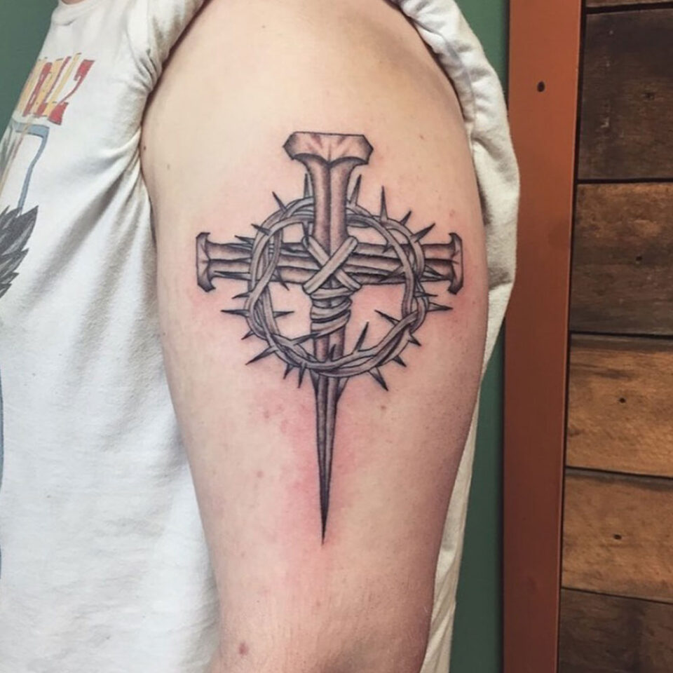 Thorn Cross Tattoo Source @hunter.jade.tattoos via Instagram