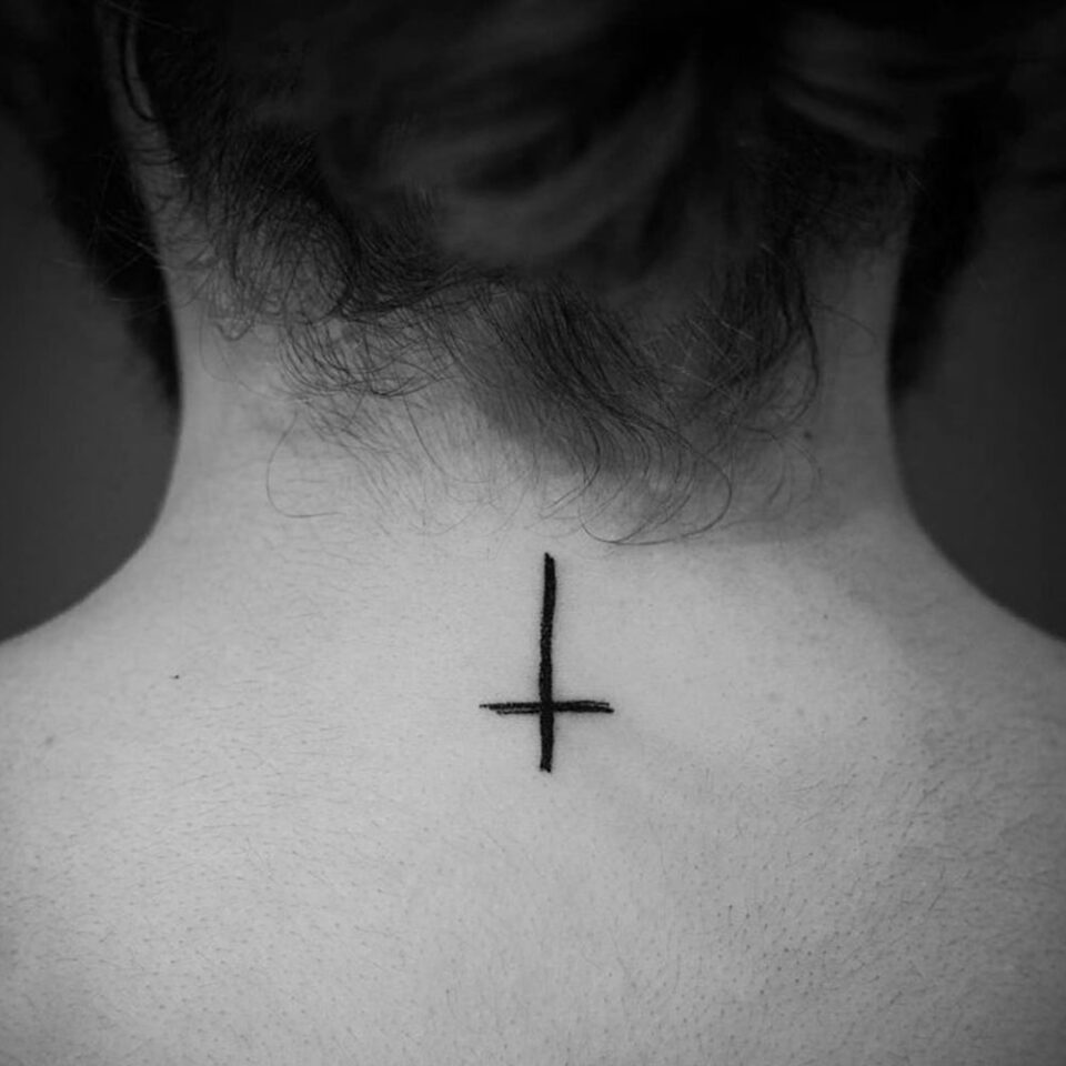 Upside Down Cross Tattoo Source @sophiancholettattoo via Instagram