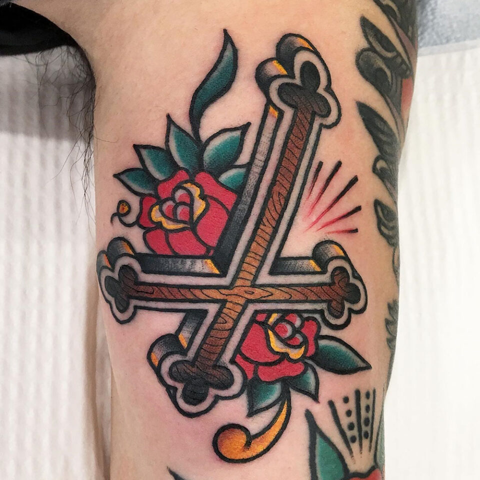Upside Down Cross Tattoo Source @harringtontattoo via Instagram