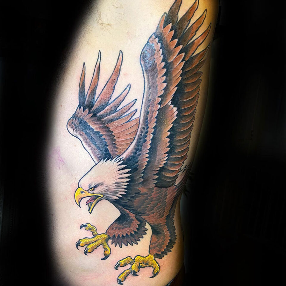 Bald Eagle tattoo with beak open in mid-flight Source @artisticbingestudio via Facebook
