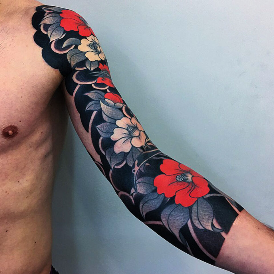 Camellia floral tattoo sourced via IG @caiopineiro