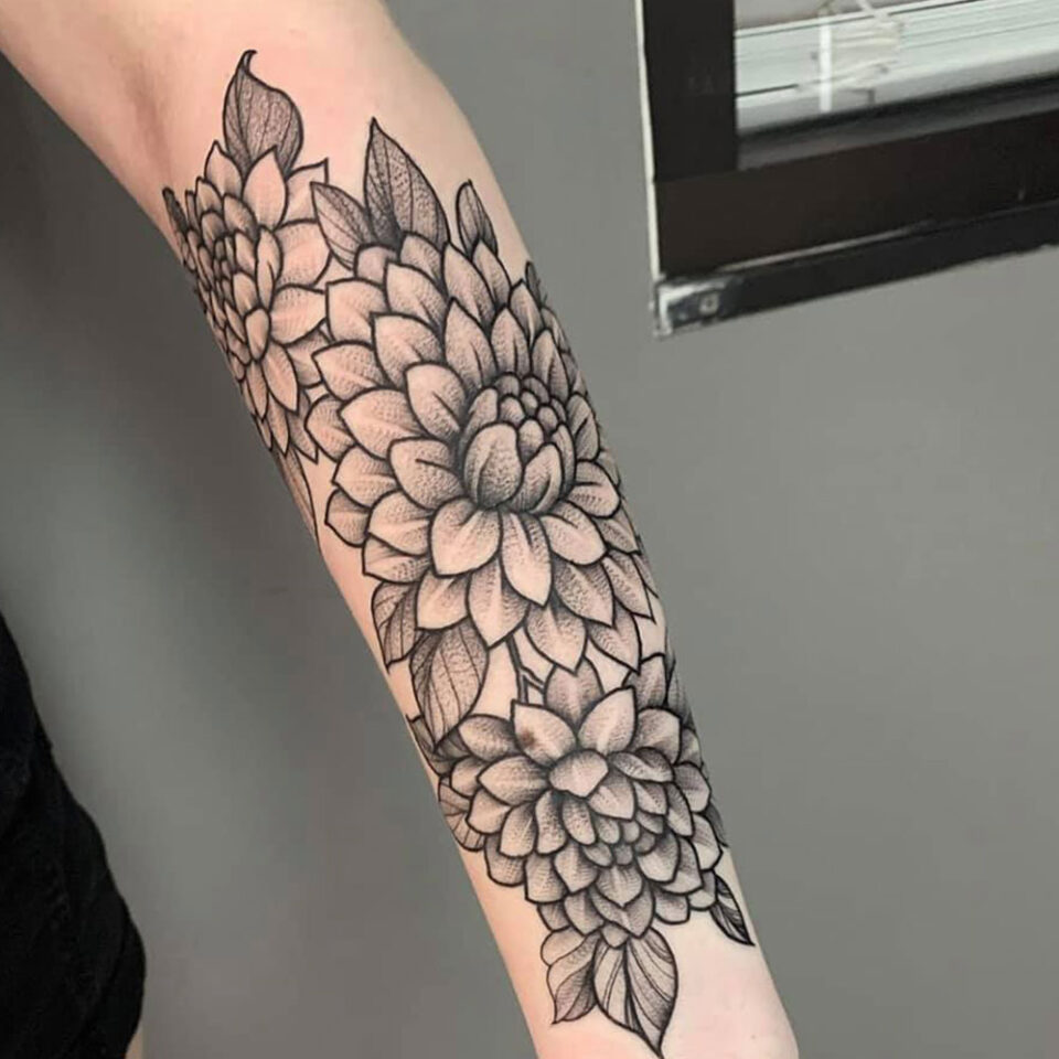Dahlia floral tattoo sourced via IG @manifesttattoosociety