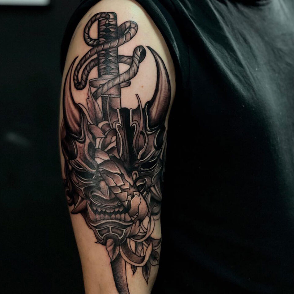 Demon with sword tattoo Source @tattoo.anastasiia via Instagram