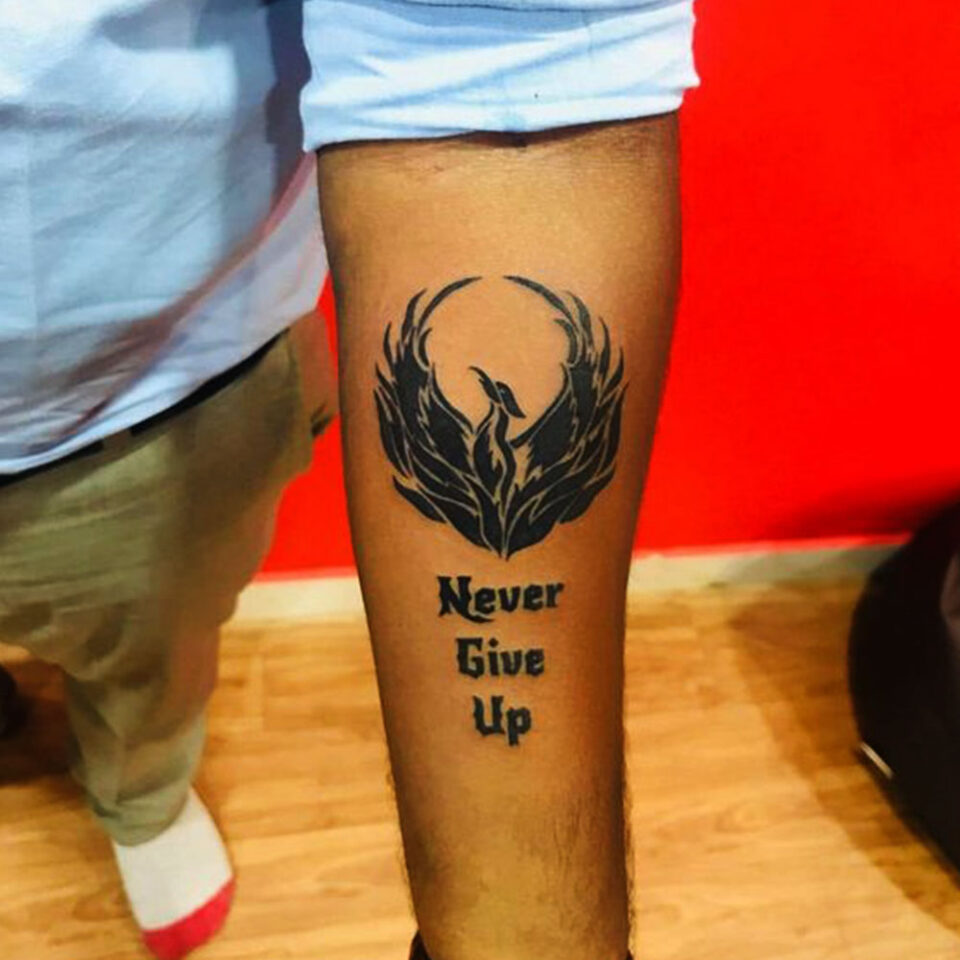 Eagle tattoo with Never Give Up banner