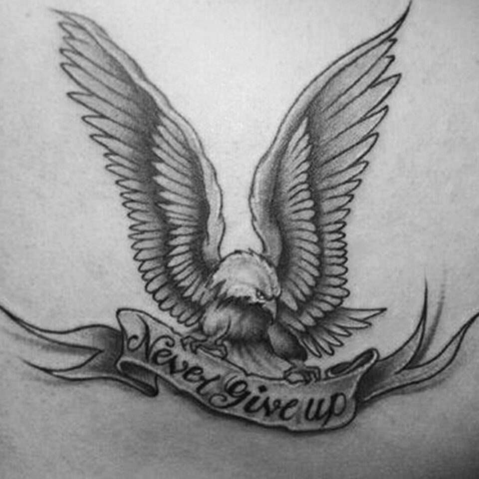 Eagle tattoo with Never Give Up Banner