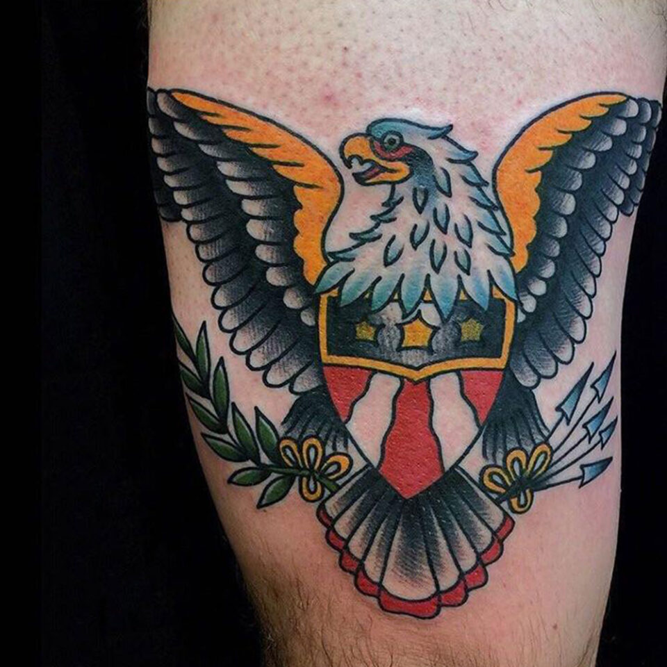 Eagle tattoo with Shield and Crossed Swords Source @carlospereztattooer via Instagram