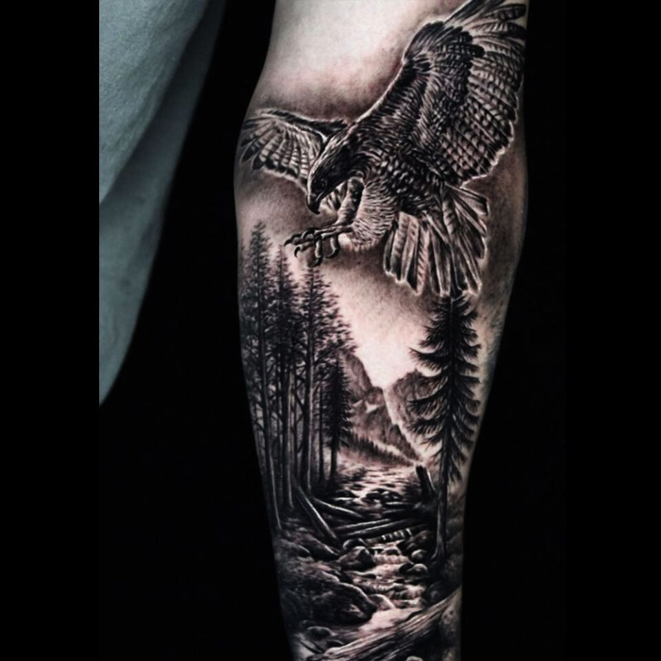 Eagle tattoo with a landscape background